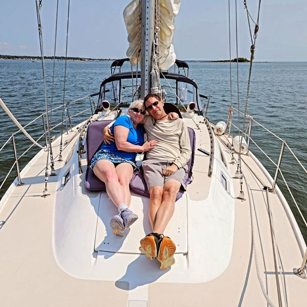Couple lying on deck on Long Island Sound